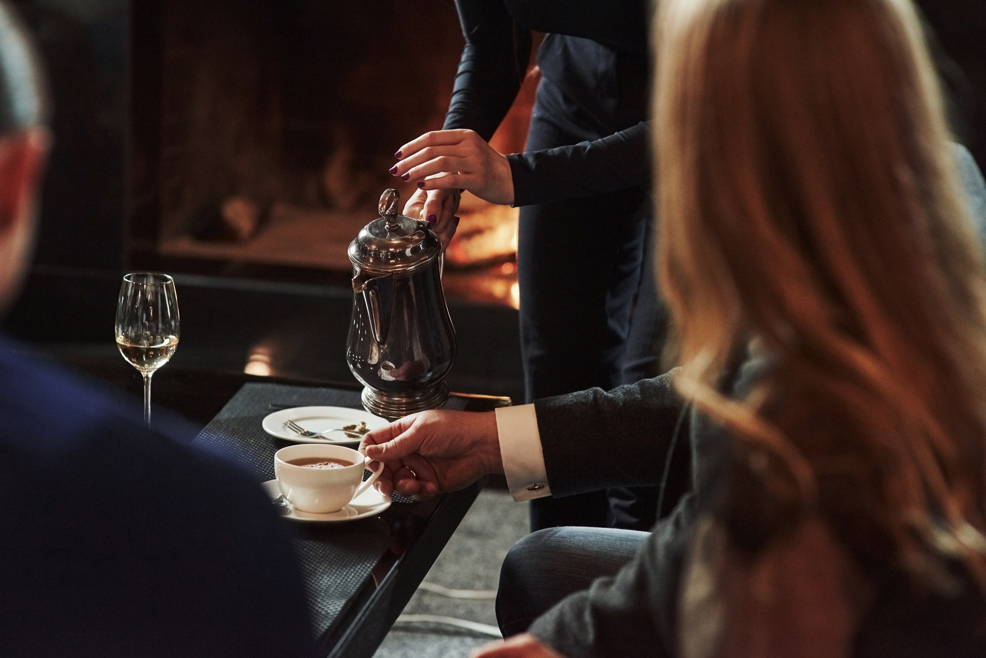 friends-sits-in-the-restaurant-with-beautiful-fireplace-in-it.jpg